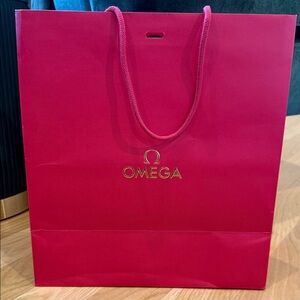 Omega Red Shopping Bag with Gold Logo